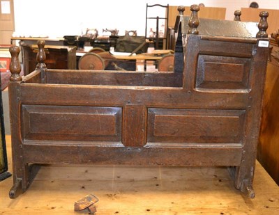 Lot 1566 - An 18th century panelled oak cradle