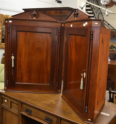 Lot 1574 - A pair of modern mahogany corner cupboards