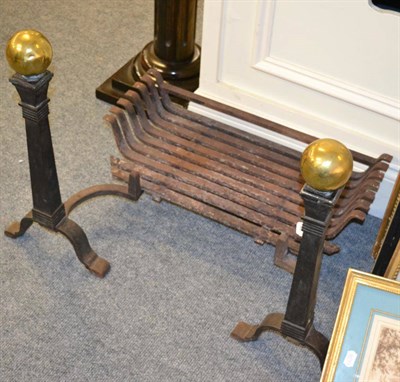 Lot 1582 - A fire dog grate with brass finials