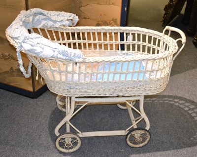 Lot 1585 - ^An early 20th century wicker basket pram