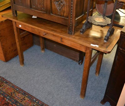 Lot 1587 - A Provincial oak side table, of two plank construction with cleated ends, raised on chamfered legs