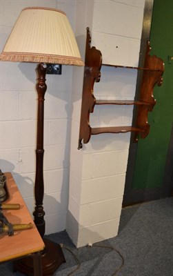 Lot 1590 - A mahogany standard lamp and shade together with a set of three tier mahogany hanging shelves