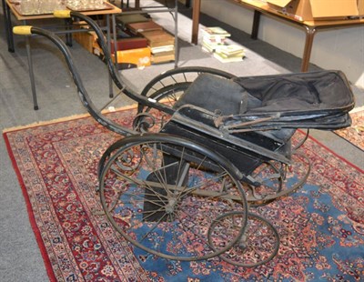 Lot 1591 - A late Victorian invalid carriage, with canopy hood, metal frame and wheels