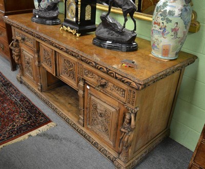 Lot 1613 - A carved oak Victorian sideboard