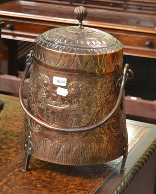 Lot 1644 - A late 19th century Dutch copper doff pot and cover with swing handle