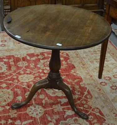 Lot 1661 - A George III mahogany tilt top table on bird cage platform