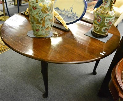 Lot 1670 - ^An early George III mahogany six-eight seater gateleg dining table, circa 1760, with rounded...