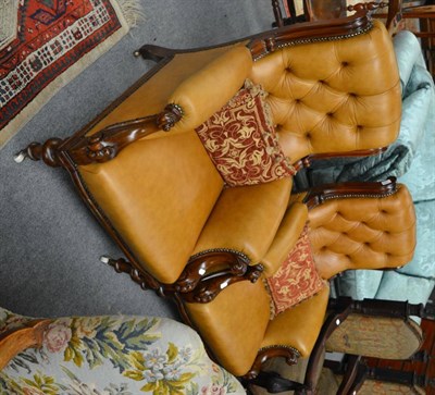 Lot 1680 - A pair of Victorian armchairs, later recovered in button back leather