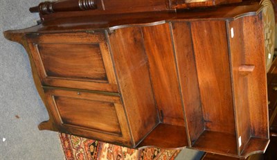 Lot 1707 - A late 19th century mahogany waterfall dwarf bookcase, fitted with two cupboard doors