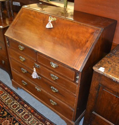 Lot 1716 - A George III mahogany and tulipwood crossbanded bureau