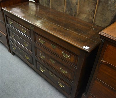 Lot 1729 - ^A George III joined oak chest, circa 1760, the hinged lid above four sham drawers and two real...