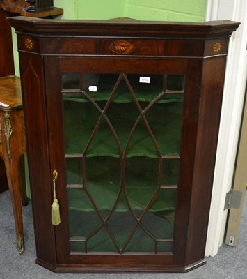 Lot 1746 - #A George III mahogany hanging corner cupboard, with astragal glazed door