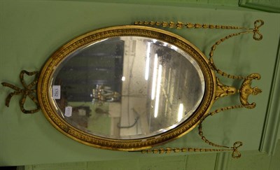 Lot 1762 - A gilt framed oval wall mirror