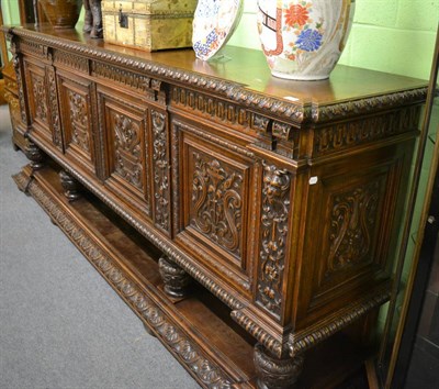 Lot 1764 - A carved oak sideboard