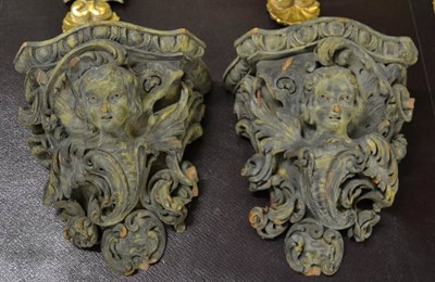 Lot 1769 - Pair of rococco style painted carved wood wall sconces with figural supports, 21.5cm