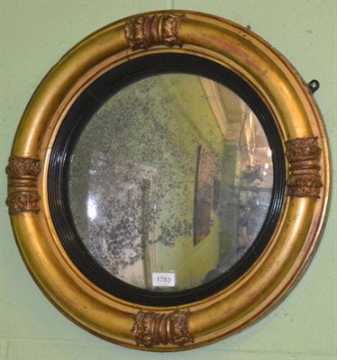 Lot 1783 - An early 19th century giltwood circular wall mirror