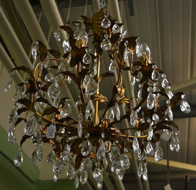 Lot 1788 - A reproduction gilded chandelier with cut glass drops