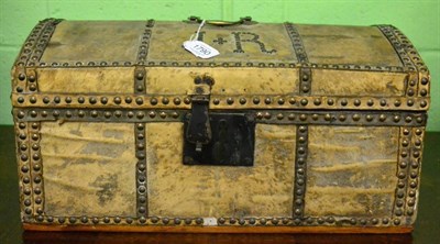 Lot 1790 - Hide covered domed small trunk, studded detail and initials J R, with paper lining and label...