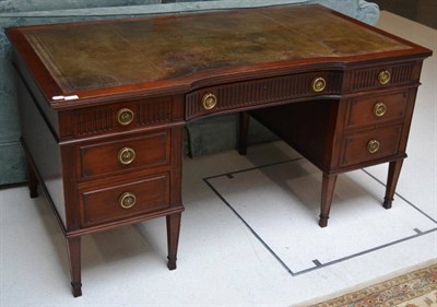 Lot 1798 - A 19th century mahogany desk of inverted curved form labelled Hicks, 150cm wide