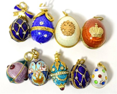 Lot 10 - Ten egg charms, enamelled in various colours, some paste set and some hinged to open