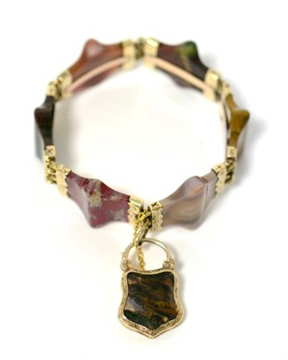 Lot 11 - A Scottish style bracelet, formed of shaped banded agate and hardstone links with foliate...