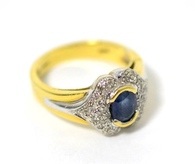 Lot 16 - An 18ct gold diamond and sapphire ring, an oval cut sapphire in a yellow half rubbed over...