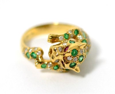 Lot 17 - An emerald, diamond and ruby panther ring, pavé set thoughout with round cut emeralds and...