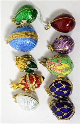 Lot 33 - Ten egg charms, enamelled in various colours, some paste set and some hinged to open