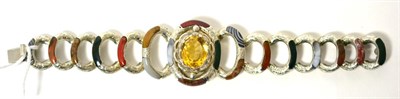 Lot 46 - A Scottish style bracelet, an oval cut citrine in fancy claw setting, within a polished agate...