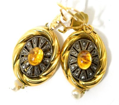 Lot 49 - A pair of drop earrings, yellow flower motifs suspend a fancy scroll frame with an oval...
