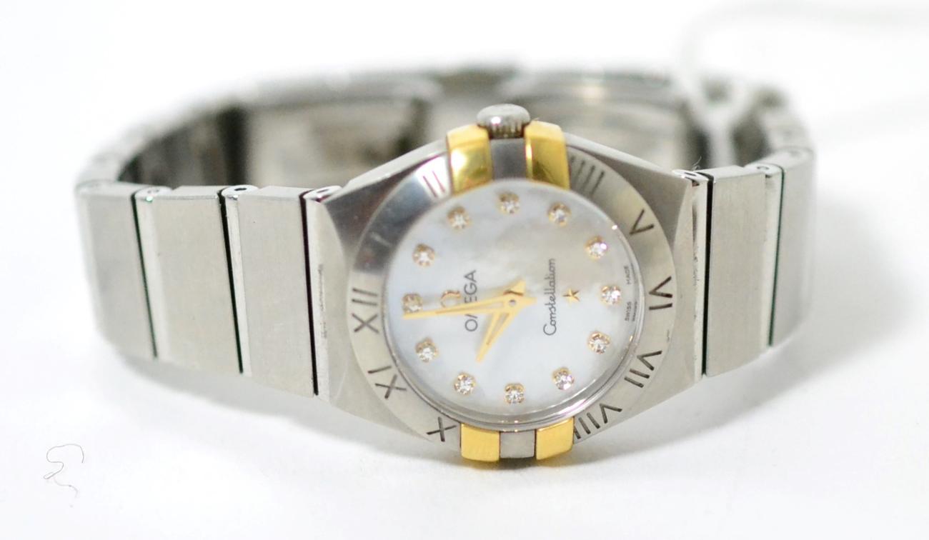 Lot 51 - A lady's stainless steel wristwatch with a diamond set hour marker dial, signed Omega,...