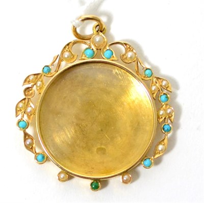 Lot 59 - A turquoise and seed pearl locket pendant, the central circular glazed locket with a wreath...