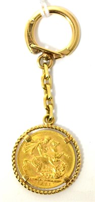 Lot 65 - A George V 1927 sovereign mounted in a scroll frame as a keyring