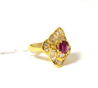 Lot 69 - A ruby and diamond cluster ring, an oval cut ruby in a yellow claw setting, within a fancy...