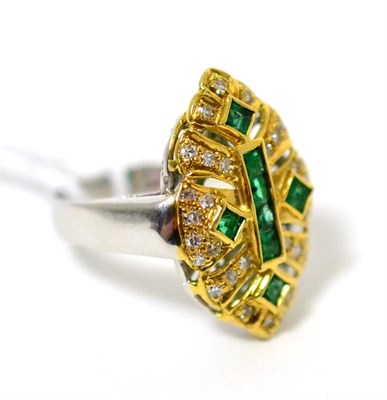 Lot 74 - An emerald and diamond ring, square step cut emeralds in yellow rubbed over and channel...