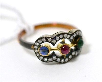 Lot 80 - A multi-gemstone and diamond ring, a round cabochon ruby, emerald and sapphire in yellow rubbed...