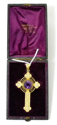 Lot 87 - An amethyst and white enamel Celtic cross pendant, a round cut amethyst in a yellow rubbed over...