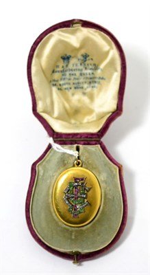 Lot 88 - A diamond, ruby and emerald locket, the oval locket with applied entwined initals 'EFY' set...