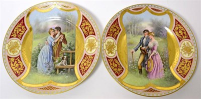 Lot 91 - A pair of Vienna cabinet plates, each painted and gilt with a scene of a romantic couple in a...