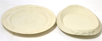 Lot 102 - A parian dish, moulded with bishop's arms, 33cm diameter; and a parian bread dish, 33cm (2)