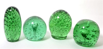 Lot 105 - Four various green glass dumps, each containing air inclusions, the tallest 17cm high