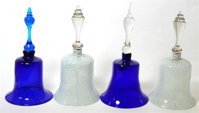 Lot 107 - Two latticino glass table bells, 31cm high; and two blue glass table bells (4)