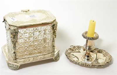 Lot 108 - A silver plated and cut glass biscuit box, 16cm high; and an Old Sheffield plate chamberstick, 11cm