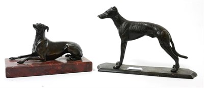 Lot 112 - A late 19th century French bronze model of a recumbent hound, marble plinth base, 16.5cm long;...