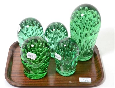 Lot 123 - A group of five Victorian green glass dumps with air inclusions, the largest 21cm high