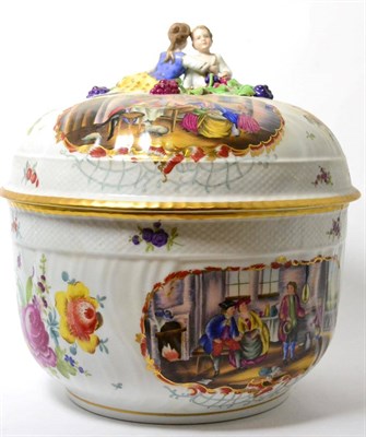 Lot 133 - A Carl Thieme, Potschappel porcelain tureen and cover, with figural finial, painted with figures in