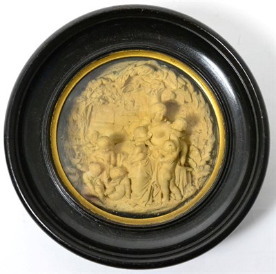 Lot 135 - An Italian composition relief plaque depicting a mother and children, 10cm diameter, framed