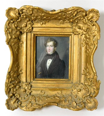 Lot 137 - English School (early 19th century): a miniature bust portrait of a gentleman wearing a black...