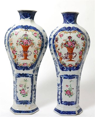 Lot 149 - A pair of Chinese porcelain hexagonal baluster vases, Qianlong, painted in famille rose enamels and