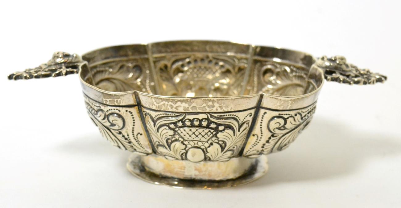 Lot 153 - A Continental silver twin-handled sugar bowl, Sheffield import marks for 1900, of lobed oval...